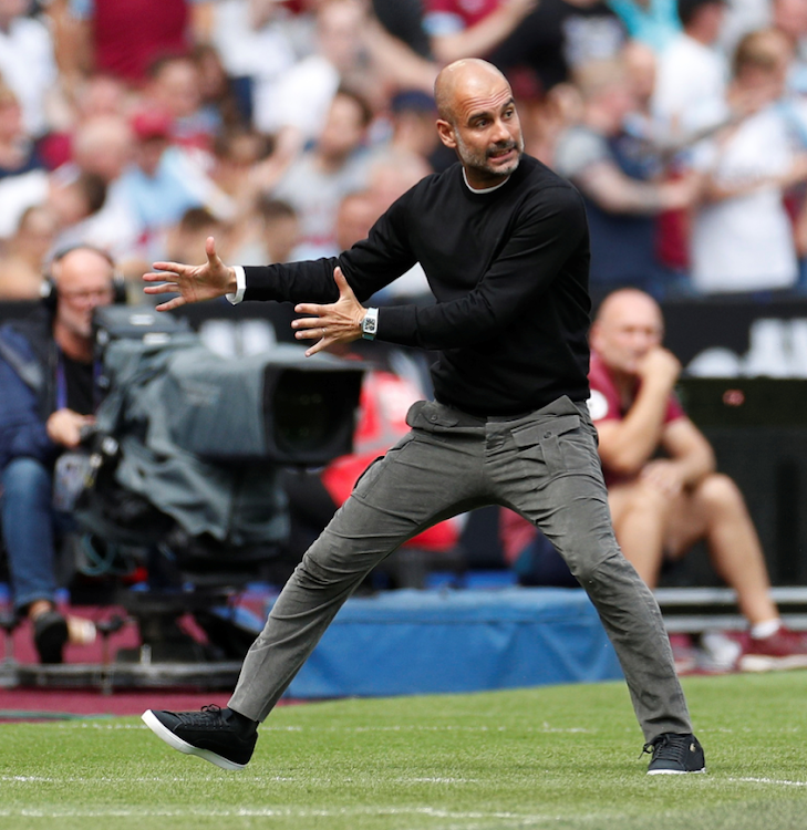 Manchester City manager Pep Guardiola gestures during a past match