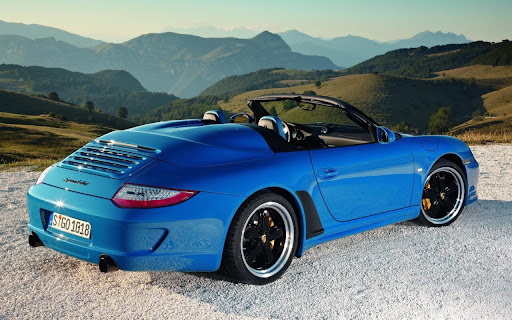 Blue Sports Car Parked on a Scenic Mountain screenshot 2