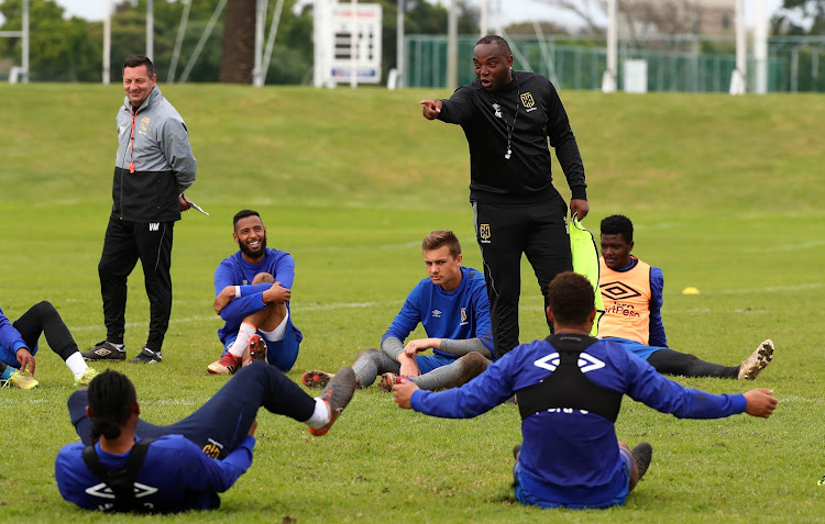 Cape Town City FC head coach Benni McCarthy shares a funny moment with his players during a training session and media day at Hartleyvale, Cape Town on August 1 2018.