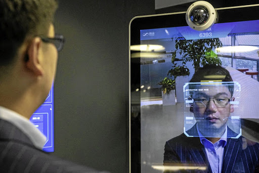 Xu Li, CEO of SenseTime Group, is identified by the company's facial-recognition system on a screen at SenseTime's showroom in Beijing. Facial recognition technology could soon be used to collects a database of information on ordinary citizens.