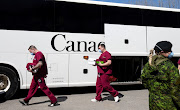 A bus carrying Canadian armed forces medical personnel arrives at Villa Val des Arbres, a seniors' long-term care centre, to help during the Covid-19 pandemic in Montreal, Quebec.