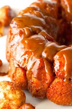 Monkey Bread with Salted Caramel Sauce was pinched from <a href="http://deliciouslyyum.com/monkey-bread-with-salted-caramel-sauce/" target="_blank">deliciouslyyum.com.</a>