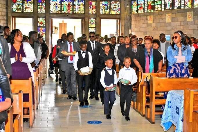 Sports CS Ababu Namwamba and his family make an entrance to the Consolata Shrine during the requiem mass of ex-wife Prisca Mwaro