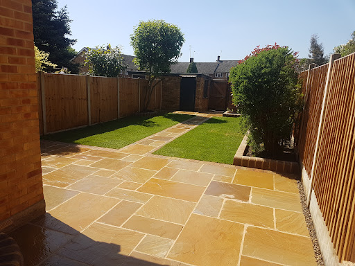 Buff blend Indian sandstone with autum gold boarder, autum gold raised bullnose  flower bed, new turf