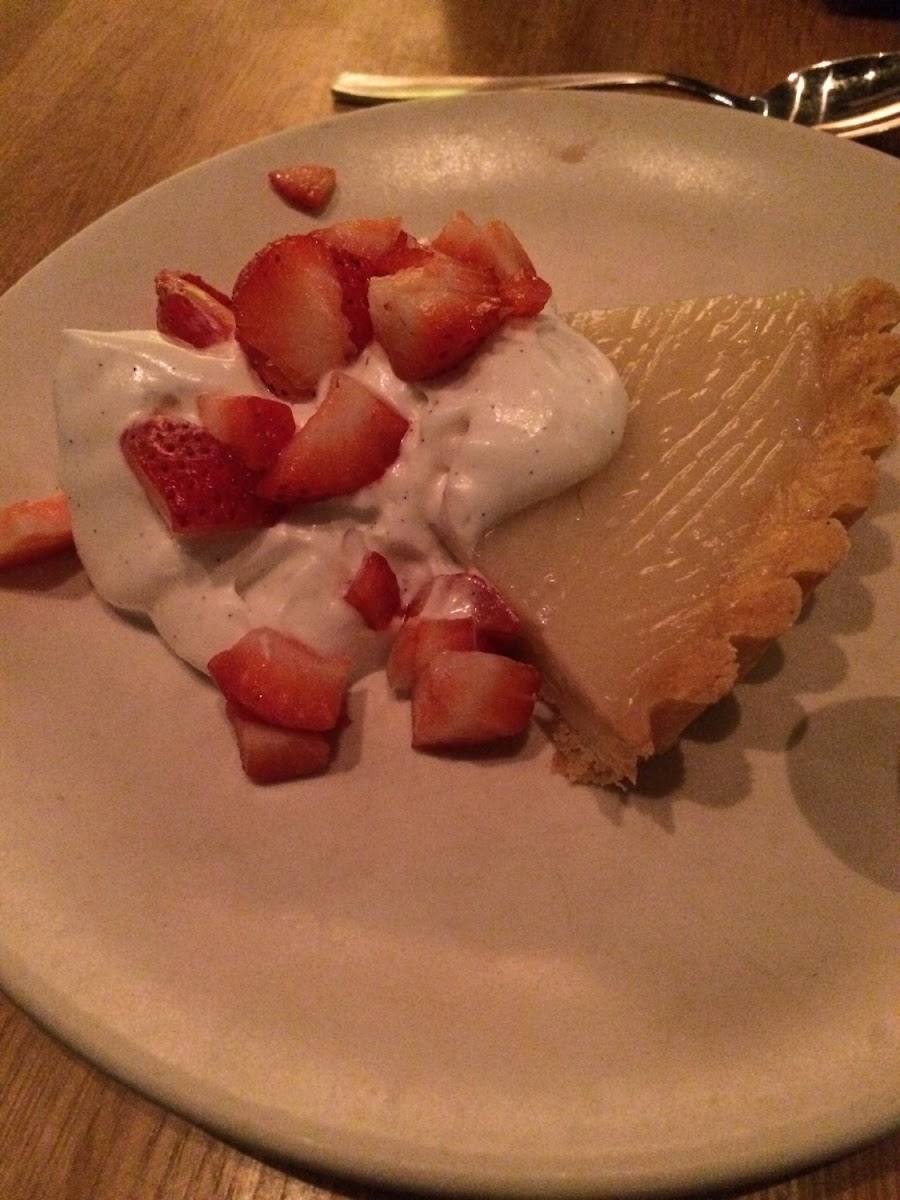 GF lemon tart with coconut whipped cream and fresh strawberries. Photo by Cg.