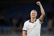 Manchester City striker Erling Haaland celebrates after the team's victory in the Premier League match against Burnley FC at Turf Moor on August 11, 2023 in Burnley, England.