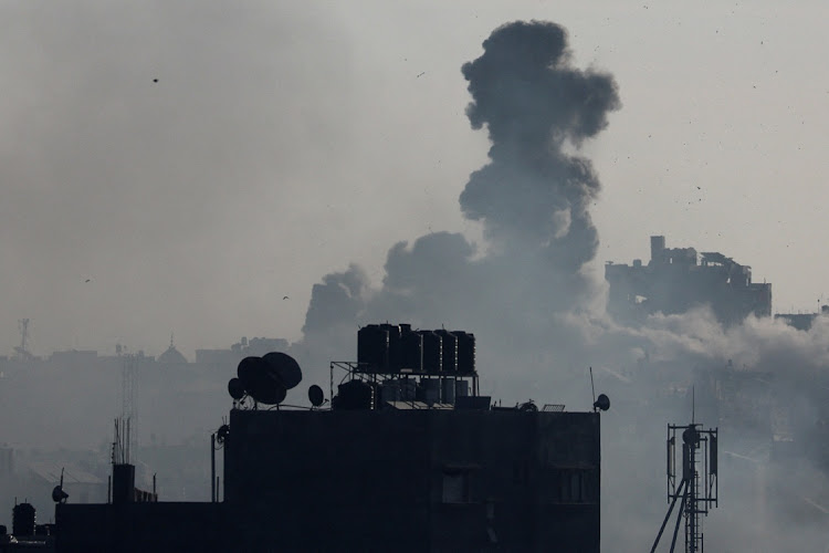 Smoke rises after Israeli strikes in Khan Younis in the southern Gaza Strip, December 10 2023. Picture: IBRAHEEM ABU MUSTAFA/REUTERS