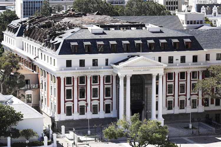 The damaged roof of the National Assembly building in the parliamentary precinct in Cape Town after last year's fire. File image.