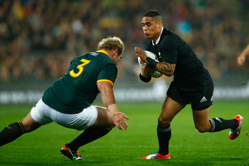 Aaron Smith of the All Blacks is tackled by Jannie du Plessis of the Springboks during The Rugby Championship match between the New Zealand All Blacks and the South Africa Springboks at Westpac Stadium on September 13, 2014 in Wellington, New Zealand.