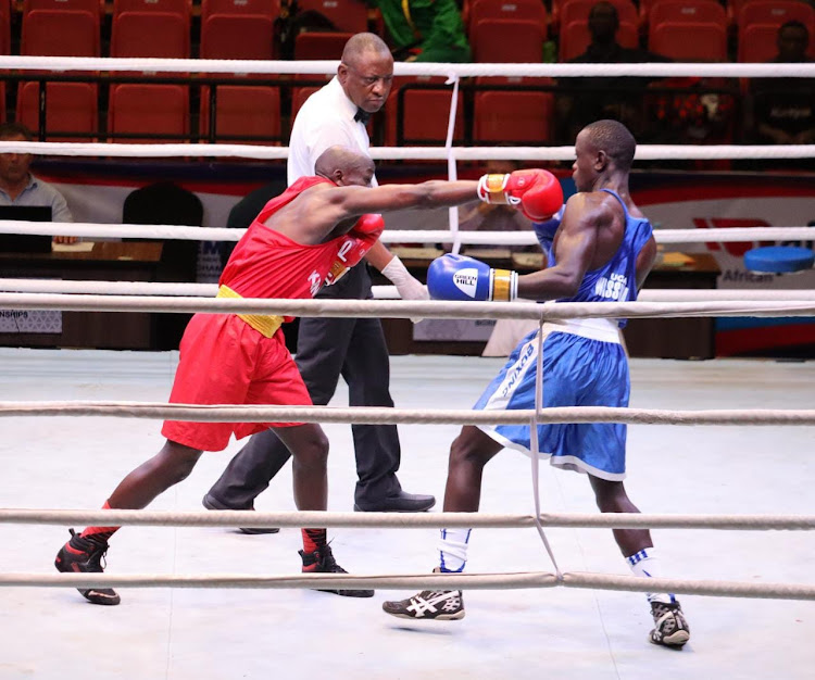 Kenya's Ethan Maina (Red) in action with Uganda's Amiri Wasswa at the African Boxing Championships