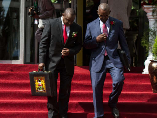 Treasury Cs Henry Rotich and PS Kamau Thugge on their way from the Treasury building to Parliament for the reading of the budget for financial year 2018/19, June 14, 2018. /ENOS TECHE