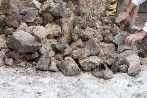 Restorers works on an archeological site on February 6, 2013 in Pompeii. An ambitious restoration project dubbed "Grande Progetto per Pompei" (Big Project for Pompeii) and financed with EU funds was launched today in a bid to give the famous site it's original lustre.