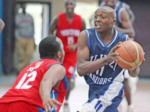 Erick Mutoro of Ulinzi challenges Anthony Hinga of Nakuru Club during their Kenya Basketball Federation League match at Nyayo Stadium Ulinzi Photo/PICCENTRE. COM.