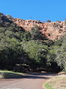 The 50m cliff at Rustenburg's Safari Gardens which a motorist crashed down. The 21-year-old motorist escaped with minor injuries 