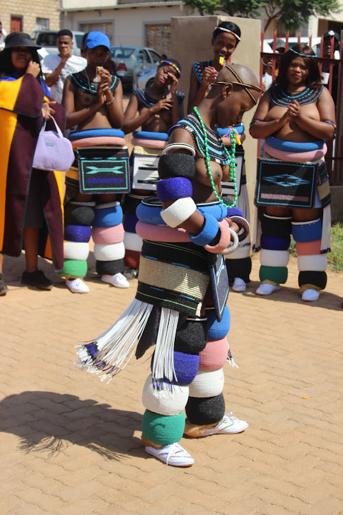 Thokozile Kabini in full Ndebele traditional regalia dancing for the guests after her month-long initiation ritual in KwaMhlanga, about 70km outside Pretoria. She also receives heaps of gifts, including furniture and gadgets on the completion of the sacred ritual.