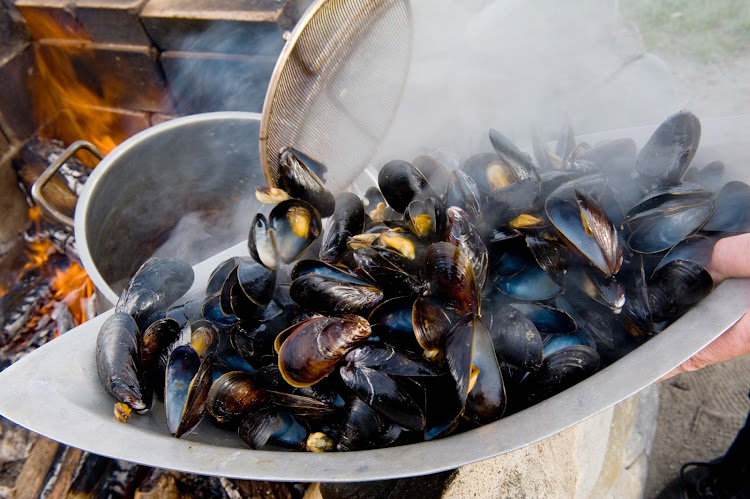 Barbecuing mussels at White Point Beach Resort in Halifax, Nova Scotia. 