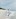 Woman walking in water on beach