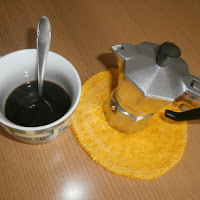 Cuccuma e caffè di 