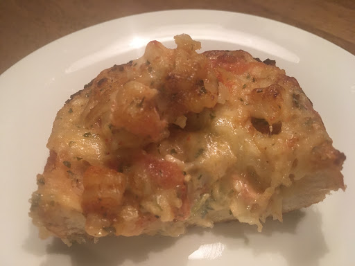 French Bread topped with Crawfish, seasonings & Cheese.  Baked until bubbly..
A South Louisiana Specialty.