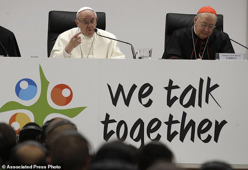 Pope Francis flanked by Cardinal Kevin Farrell, right, delivers his speech at the opening session of the pre-synod of the youths meeting, at the the Mater Ecclesiae college in Rome , Monday, March 19, 2018. (AP Photo/Alessandra Tarantino)