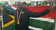 Luvo Manyonga arrives at OR Tambo International Airport.