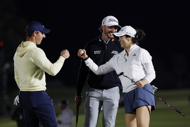 Rory McIlroy, Max Homa and Rose Zhang react on the 12th green during The Match IX at The Park West Palm on February 26 in West Palm Beach, Florida. Picture: GETTY IMAGES FOR THE MATCH/CLIFF HAWKINS