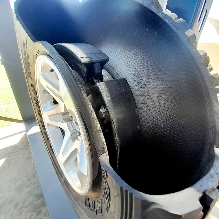 Steel rings can be optionally fitted inside tyres to allow a driver to continue on a safe path despite the wheels being shot out. Picture: PHUTI MPYANE