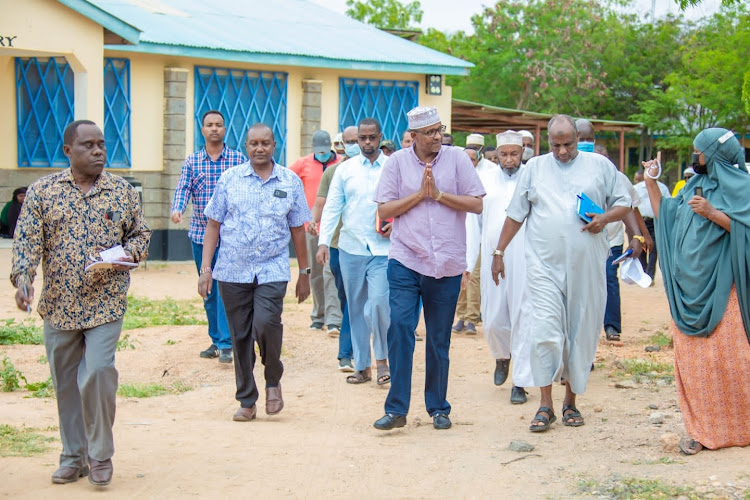 Garissa Township MP Aden Duale with board of management, teachers and security officials at Garissa High School on Wednesday, January 19.