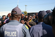 Taxi drivers having words with police north of Pretoria during the strike on Monday, June 22 2020.