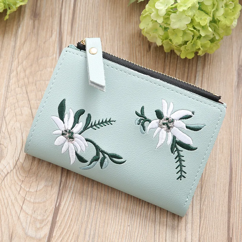 Bolso de mano fino con cremallera y bordado para mujer Ideal para llevar lo esencial con estilo. Diseño elegante y práctico para uso diario.