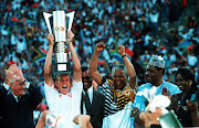 The captain of the winners of the African Cup of Nations Final Neil Tovey of South Africa holds the cup aloft after President Nelson Mandela presented it to him. South Africa won 2-0.