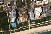 A satellite view shows the Champlain Towers building before the collapse, in Surfside near Miami Beach, Florida, US, March 11, 2021. 