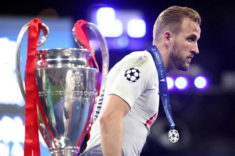 Tottenham's Harry Kane walks past the trophy after losing the Champions League Final