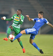 Bloemfontein Celtic midfielder Mthokozisi Dube (L) tries to evade a tackle from SuperSport left-baack Keegan Ritchie during the Absa Premiership match at Lucas Moripe Stadium on May 03, 2017 in Pretoria, South Africa. The match ended 0-0.