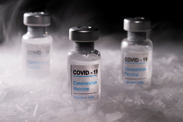 Vials labelled "Covid-19 Coronavirus Vaccine" are placed on dry ice in this illustration taken, December 4, 2020.