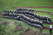 Spectators and Maritzburg College boys' school pupils watch the start of the Dusi Canoe Marathon in Pietermaritzburg. 