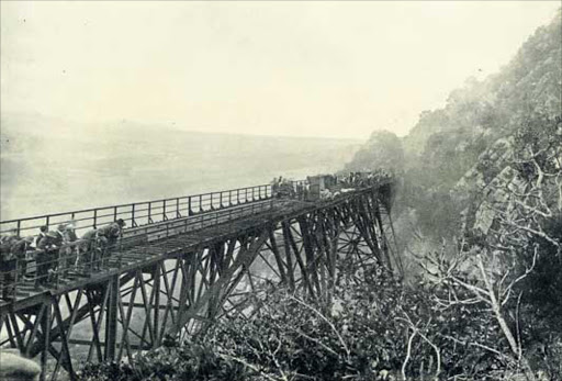 DARK DAY: Rescuers work to save who they can after the train left the Blaauwkrantz Bridge on April 22 1911. Twenty-nine lives were lost PICTURE SUPPLIED BY RHODES UNIVERSITY