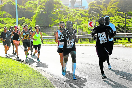 GIVING IT THEIR ALL: Some of the runners who participated in the East London Eye Hospital Laser Challenge 5km and 10km race which started at the Beacon Bay Country Club last year Picture: SIBONGILE NGALWA