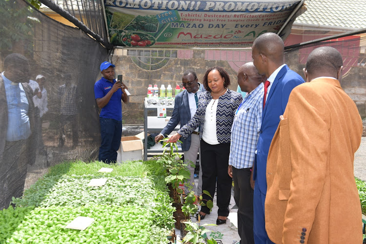 Kirinyaga Governor Anne Waiguru in one of the exhibition stands at the Kirinyaga business and agricultural expo in Mwea on Friday.