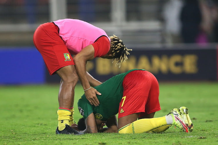 Clinton Mua Njie of Cameroon is consoled after missing his penalty in the shootout against Egypt in the the 2021 Africa Cup of Nations semifinal at Olembe Stadium in Yaounde, Cameroon on February 3 2022.