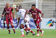 Kagiso Malinga of Swallows FC is challenged by Nathan Sinkala of Stellenbosch FC.