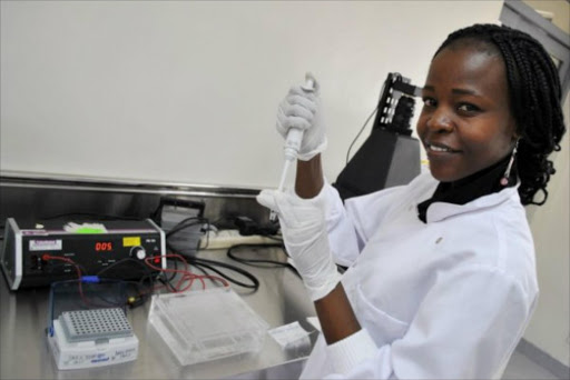 A Kenya Wildlife Service laboratory technician displays equipment in the new forensic and genetic laboratory in Nairobi.