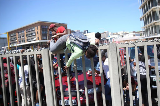 BRUTAL EXIT Walter Sisulu University flee the police in East London after they set off stun grenades.