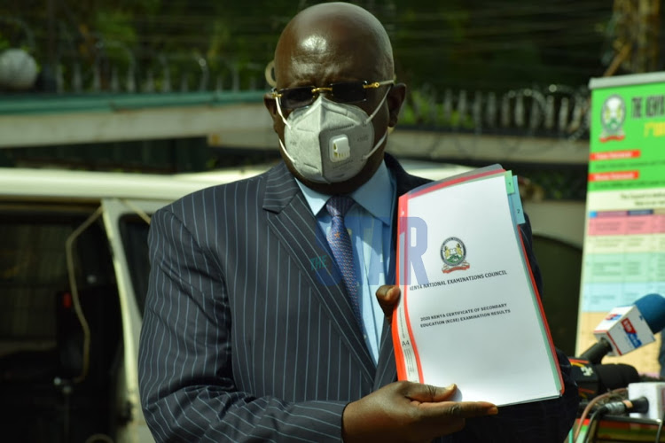 Education CS George Magoha holds the report of the 2020 KCSE results in Nairobi on Monday May 10, 2021 when he released the results