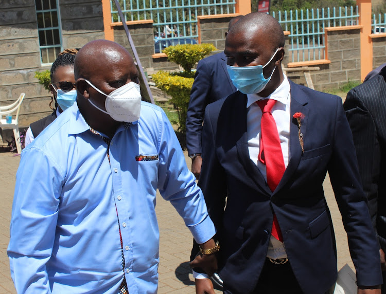 Nyeri governor Mutahi Kahiga with nominated MCA Patrick Mutahi, who is also the Youth, Gender, Social Services and Special Programmes committee chairman at the county assembly, when the governor arrived for the launch of youth development policy public participation events at Mweiga NG-CDF hall in Kieni West Sub County on Monday