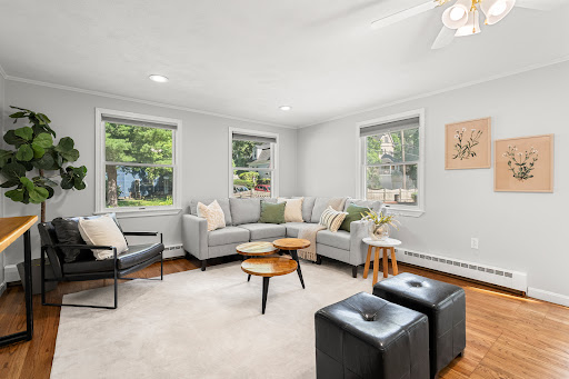 Buy this luxury property in Arlington (United States) - Bright living room with grey sofa and nesting tables