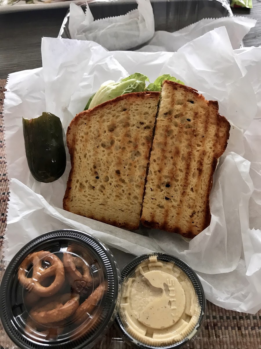 Vegan veggie cheese burger with a side of o hummus.