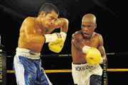 BACK ON TOP:  
      Thompson Mokwana, right, seen here  against 
       Matias Ezequiel, defeated Patrick Malinga at the Orient Theatre in East London at the weekend to reclaim the SA lightweight title
      
      
      Photo: Gallo Images