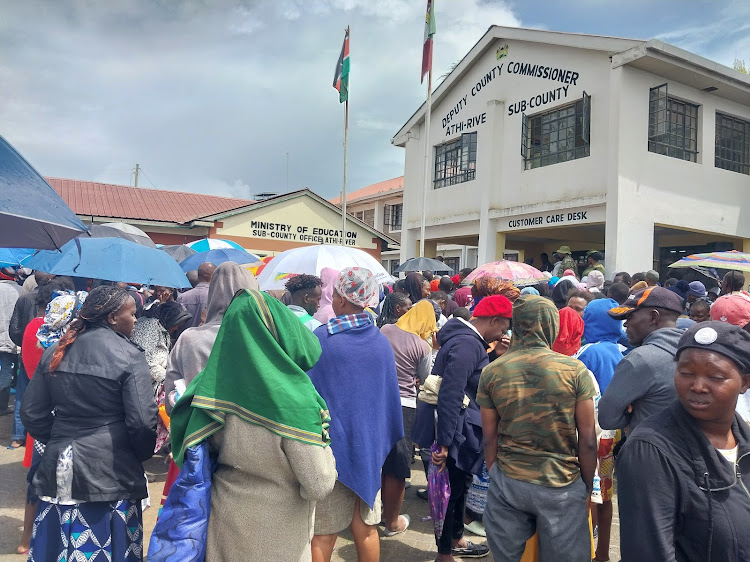 Residents brave chilly weather as they wait to receive governments' relief food during a donation drive at Athi River deputy county commissioner's office on April 25, 2024.