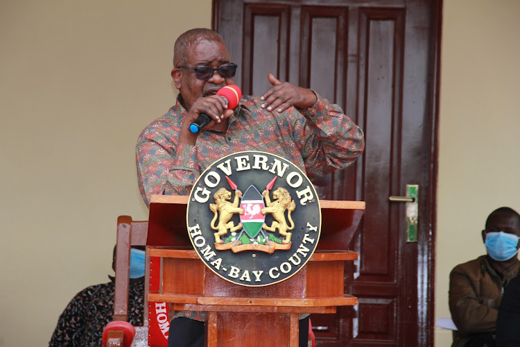 Homa Bay Governor Cyprian Awiti during the swearing in of five chief officers and Sports and Culture executive Maurice Okwany in Homa Bay town on December 31 last year.